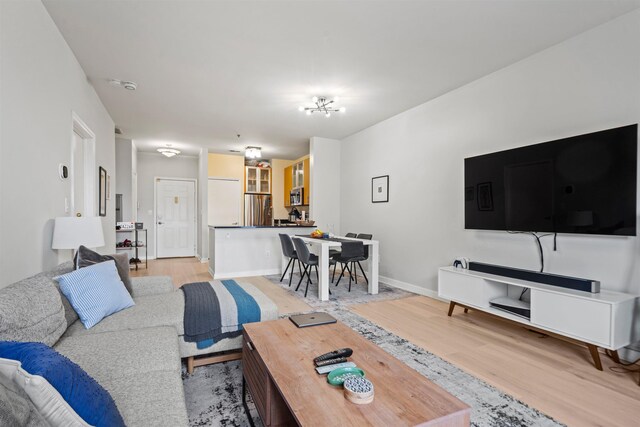 24 Ave At Port Imperial Unit 305, West New York, NJ 07093 - living area featuring light wood-style flooring and baseboards