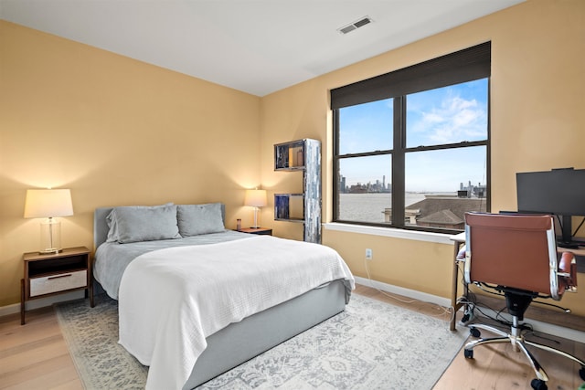 24 Ave At Port Imperial Unit 305, West New York, NJ 07093 - bedroom featuring baseboards, visible vents, and light wood-style flooring