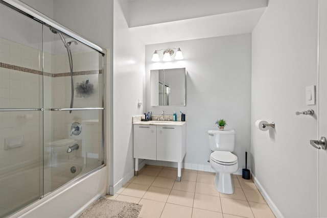 24 Ave At Port Imperial Unit 305, West New York, NJ 07093 - bathroom with tile patterned floors, toilet, baseboards, vanity, and enclosed tub / shower combo