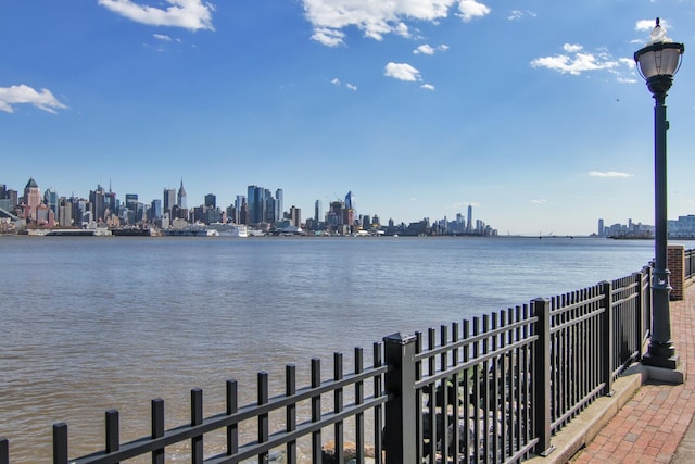 24 Ave At Port Imperial Unit 305, West New York, NJ 07093 - water view with fence and a view of city