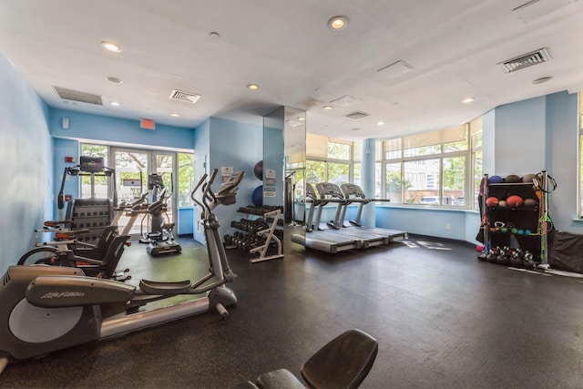 workout area with healthy amount of natural light, recessed lighting, and baseboards