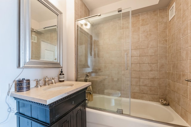 full bath featuring bath / shower combo with glass door and vanity
