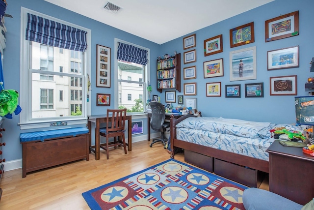 123 Tidewater St Unit B, Jersey City, NJ 07302 - bedroom with wood finished floors and a desk