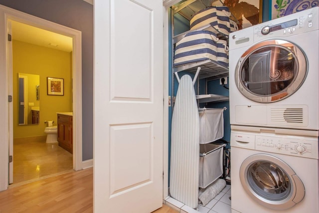 123 Tidewater St Unit B, Jersey City, NJ 07302 - laundry room featuring stacked washer and clothes dryer and light wood-style floors