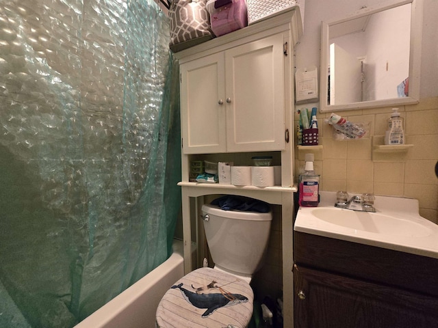 207 48th St Unit 4Aka 2A, Union City, NJ 07087 - bathroom featuring vanity, shower / tub combo with curtain, tile walls, toilet, and tasteful backsplash
