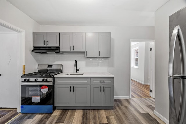 20 Martin Luther King Jr Dr, Jersey City, NJ 07305 - kitchen with stainless steel appliances, gray cabinets, a sink, exhaust hood, and dark wood-style floors