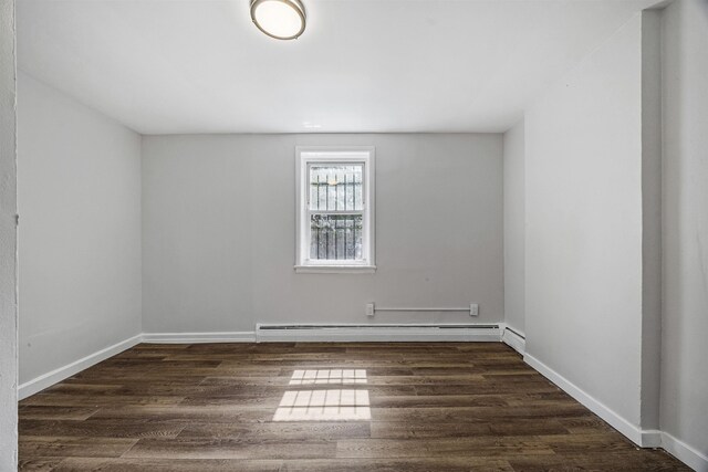 20 Martin Luther King Jr Dr, Jersey City, NJ 07305 - spare room featuring baseboard heating, dark wood-style flooring, and baseboards