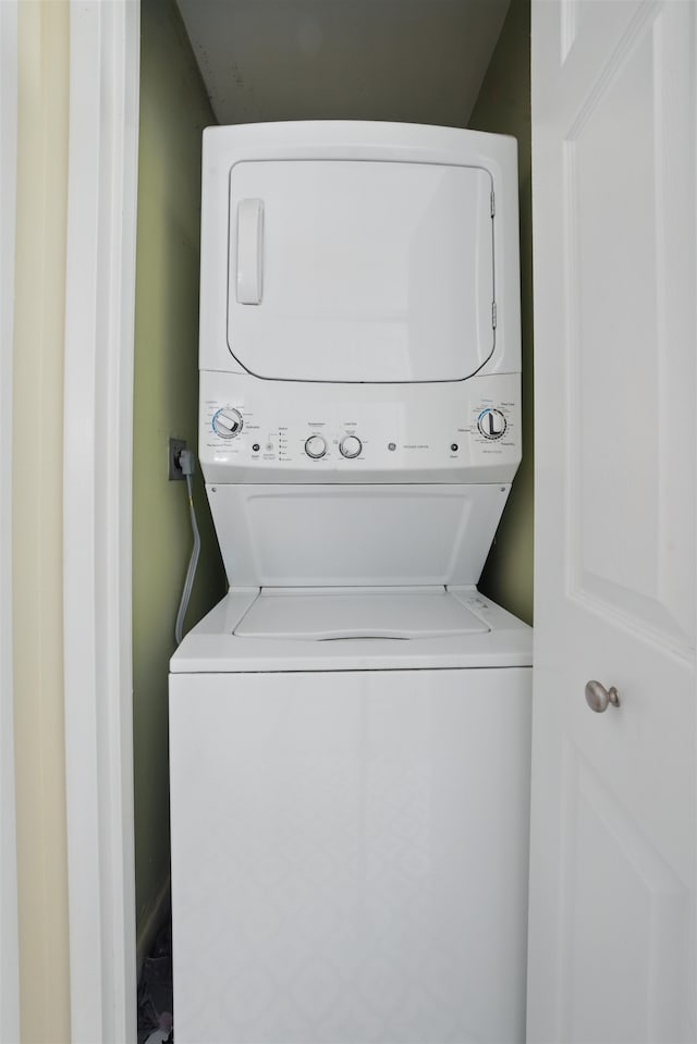 laundry area with laundry area and stacked washing maching and dryer