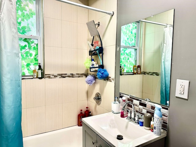 bathroom featuring vanity and shower / tub combo with curtain