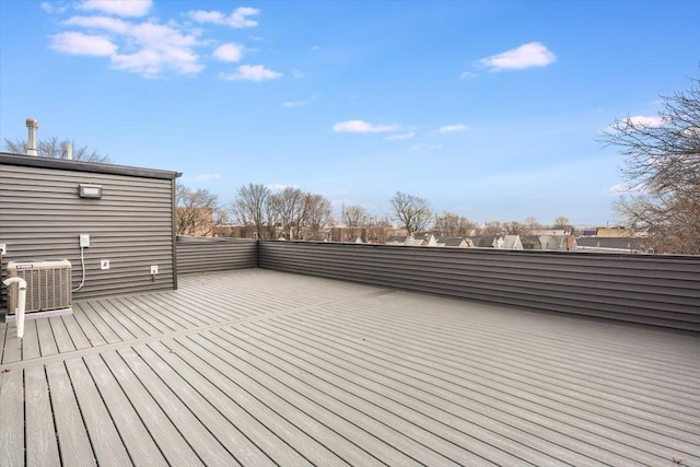 wooden deck featuring cooling unit