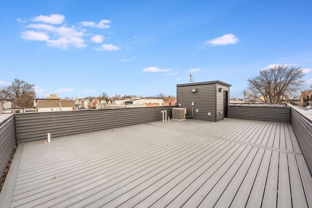 wooden deck featuring central AC unit