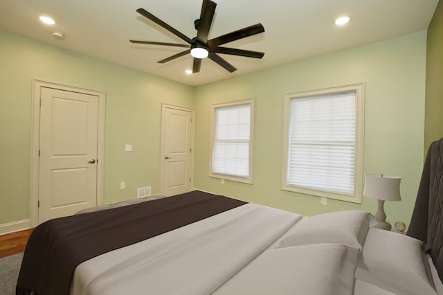 bedroom featuring ceiling fan and wood-type flooring