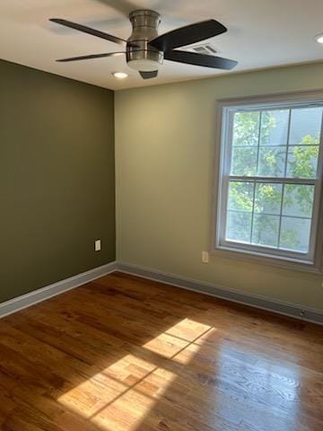 spare room featuring ceiling fan and wood-type flooring