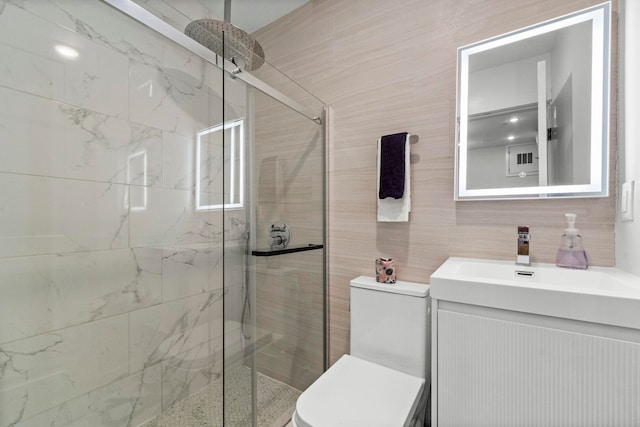 35 Manhattan Ave Unit 4, Jersey City, NJ 07307 - full bath with a marble finish shower, vanity, and tile walls