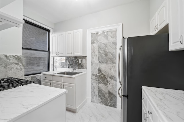 2600 Kennedy Blvd Unit 7L, Jersey City, NJ 07306 - kitchen with freestanding refrigerator, light marble finish flooring, light stone counters, and white cabinets