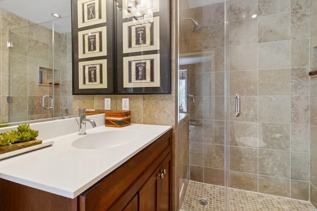 600 Harbor Blvd Unit 973/975, Weehawken, NJ 07086 - full bath with vanity, a shower stall, and tile walls