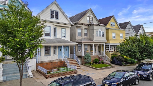 388 Kennedy Blvd, Bayonne, NJ 07002 - view of property featuring covered porch and stairway