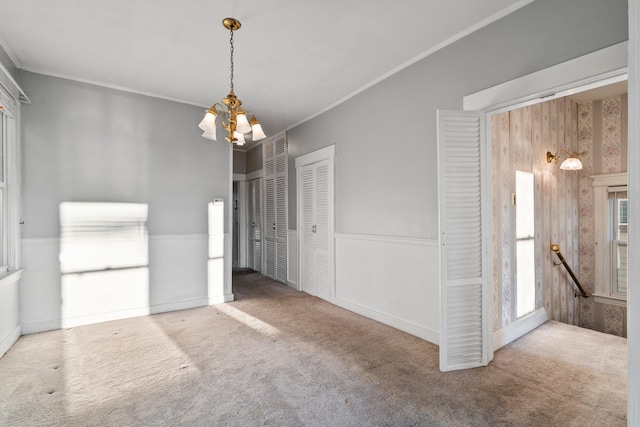 388 Kennedy Blvd, Bayonne, NJ 07002 - unfurnished dining area featuring carpet flooring, a chandelier, and ornamental molding