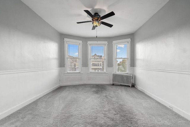 388 Kennedy Blvd, Bayonne, NJ 07002 - carpeted empty room featuring radiator heating unit and ceiling fan