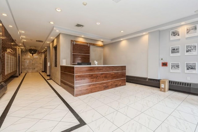 welcome area featuring a barn door and visible vents