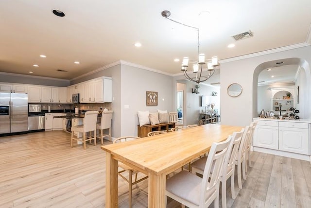 dining area with recessed lighting, visible vents, and light wood-style floors