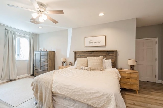 bedroom with recessed lighting, baseboards, and light wood finished floors