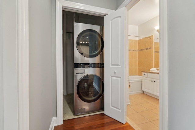 22 Ave At Port Imperial Unit 227, West New York, NJ 07093 - washroom with stacked washer and clothes dryer and tile patterned flooring