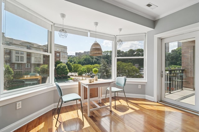 22 Ave At Port Imperial Unit 227, West New York, NJ 07093 - dining room featuring healthy amount of natural light, hardwood / wood-style flooring, and crown molding