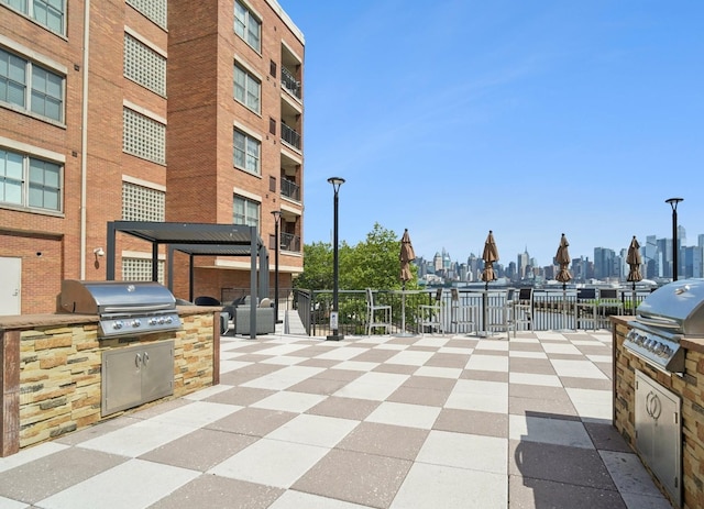 22 Ave At Port Imperial Unit 227, West New York, NJ 07093 - view of patio featuring area for grilling and a view of skyline