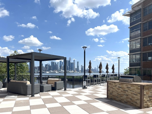 22 Ave At Port Imperial Unit 227, West New York, NJ 07093 - view of patio with exterior kitchen, an outdoor hangout area, and a skyline view