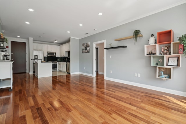22 Ave At Port Imperial Unit 227, West New York, NJ 07093 - unfurnished living room featuring crown molding, recessed lighting, and light wood-style flooring