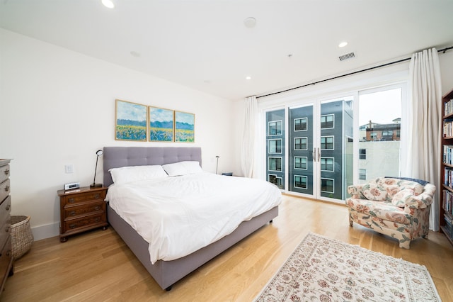74 Madison St Unit 2, Hoboken, NJ 07030 - bedroom featuring access to exterior, light wood-type flooring, and recessed lighting