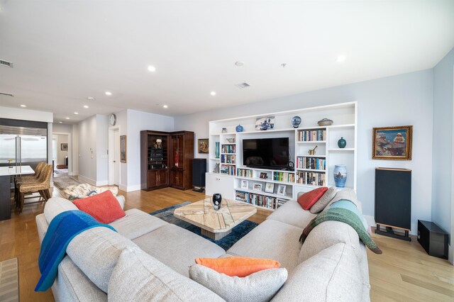 74 Madison St Unit 2, Hoboken, NJ 07030 - living area with light wood-style floors, baseboards, and recessed lighting