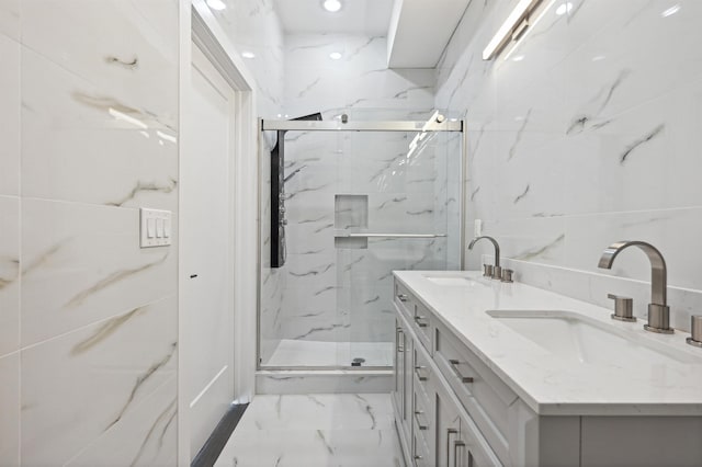 119 Van Horne St Unit 1, Jersey City, NJ 07304 - full bath with marble look tiles, a marble finish shower, and double vanity