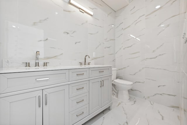119 Van Horne St Unit 1, Jersey City, NJ 07304 - bathroom featuring tile walls, marble tiled floors, and double vanity