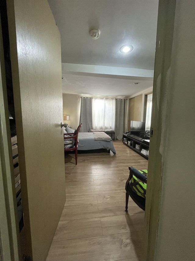 bedroom with recessed lighting and light wood-style flooring