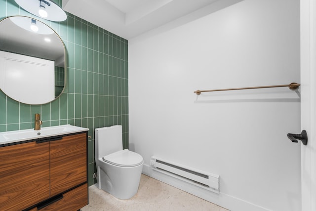 bathroom with toilet, baseboard heating, tile walls, and vanity