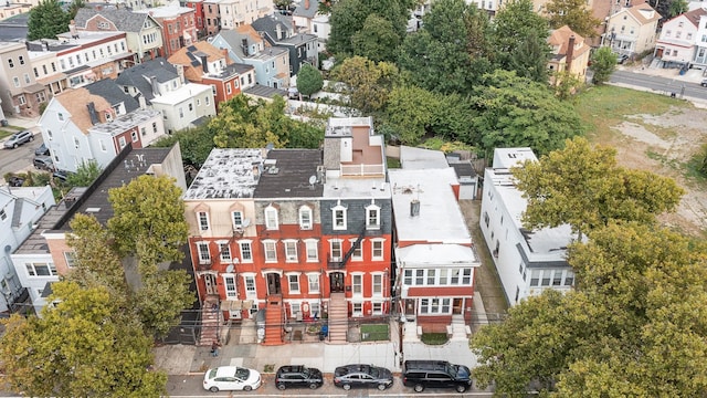 birds eye view of property with a residential view