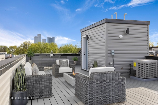 wooden deck featuring an outdoor living space and central AC