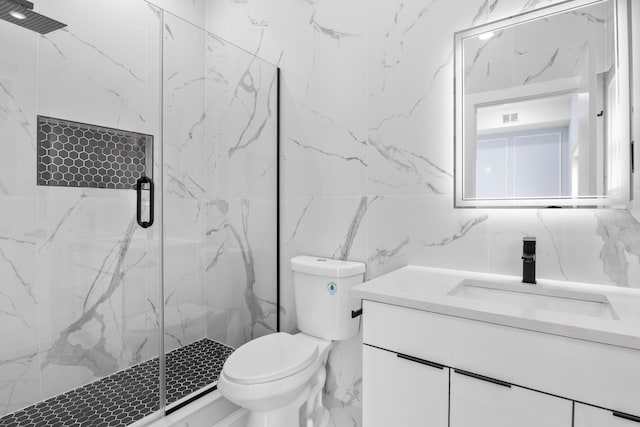 bathroom with visible vents, tile walls, vanity, toilet, and a marble finish shower