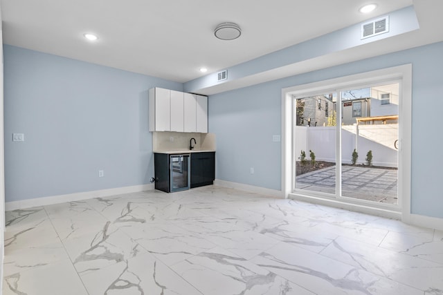 interior space featuring visible vents, recessed lighting, and baseboards
