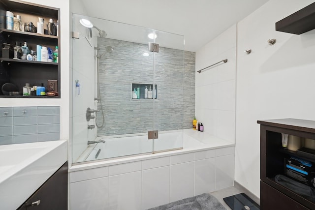 bathroom with shower / bath combination with glass door