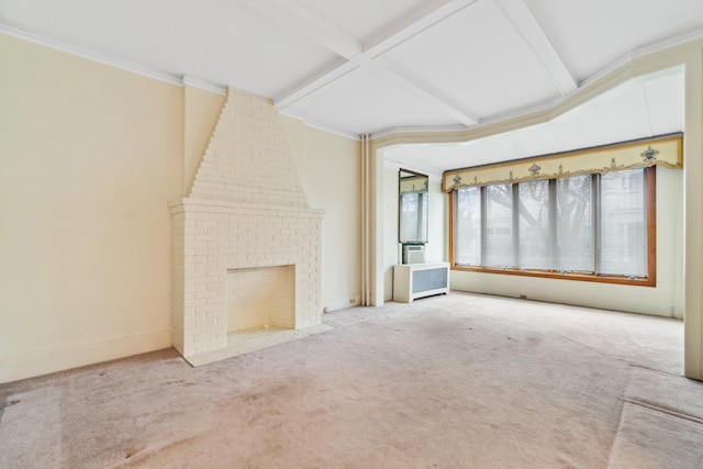 unfurnished living room with carpet, beamed ceiling, coffered ceiling, ornamental molding, and a brick fireplace