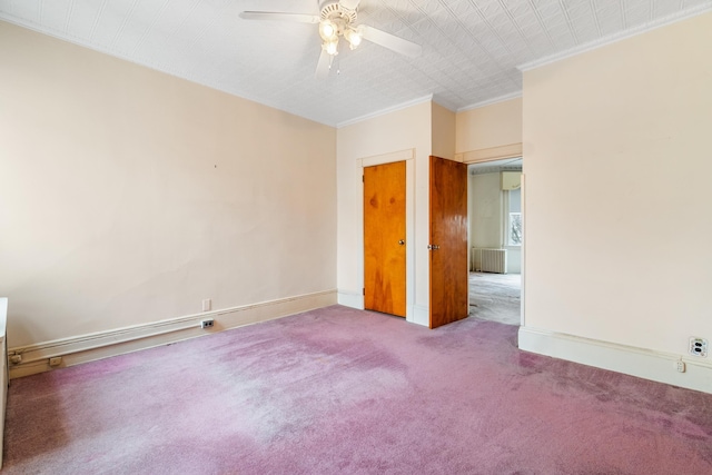 unfurnished room with radiator, baseboards, carpet, and ornamental molding