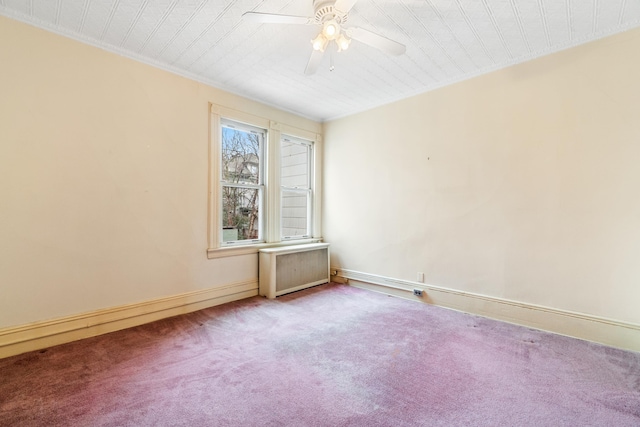 unfurnished room featuring carpet flooring, radiator, ceiling fan, and ornamental molding