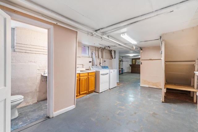 unfinished basement featuring washer and clothes dryer