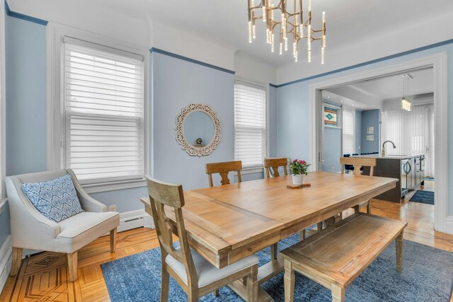7 Clifton Ter, Weehawken, NJ 07086 - dining area with a chandelier and baseboards