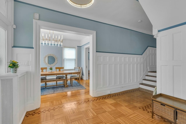 7 Clifton Ter, Weehawken, NJ 07086 - hall with a chandelier, stairway, and parquet flooring