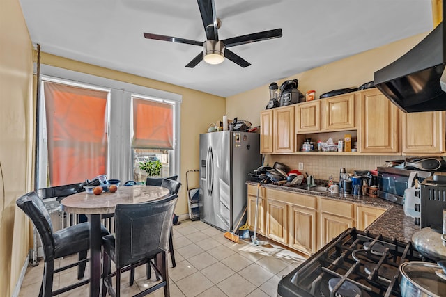 kitchen with ventilation hood, light brown cabinets, light tile patterned floors, and appliances with stainless steel finishes