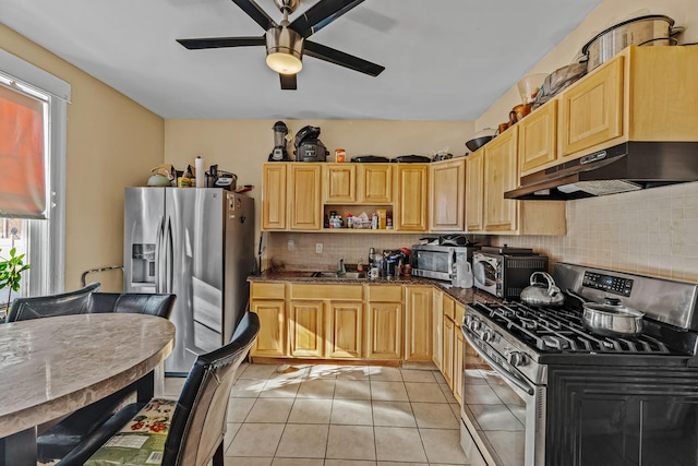 kitchen featuring ceiling fan, light brown cabinets, decorative backsplash, light tile patterned flooring, and appliances with stainless steel finishes